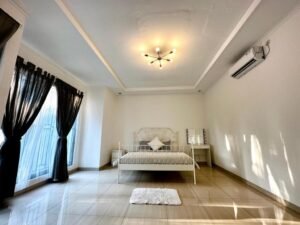 The master bedroom offers a spacious retreat with modern amenities, ensuring a comfortable stay during your time in Jakarta